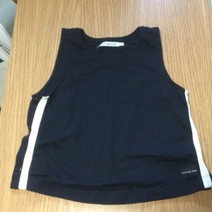 Black and white tank top: brand is “Calvin Klein”